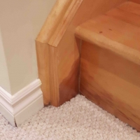 Before: Left stringer stripped near bottom step<br />
Bottom riser reveneered in maple, colour matched stained<br />
Whole area shaded to match original finish<br />
3 coats of clear lacquer to seal and add gloss<br />
<br />
Approximately 4 hrs on site