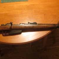 Before: 100 year old Italian service rifle.<br />
Serious finish damage due to water, ink and years of abuse.<br />

